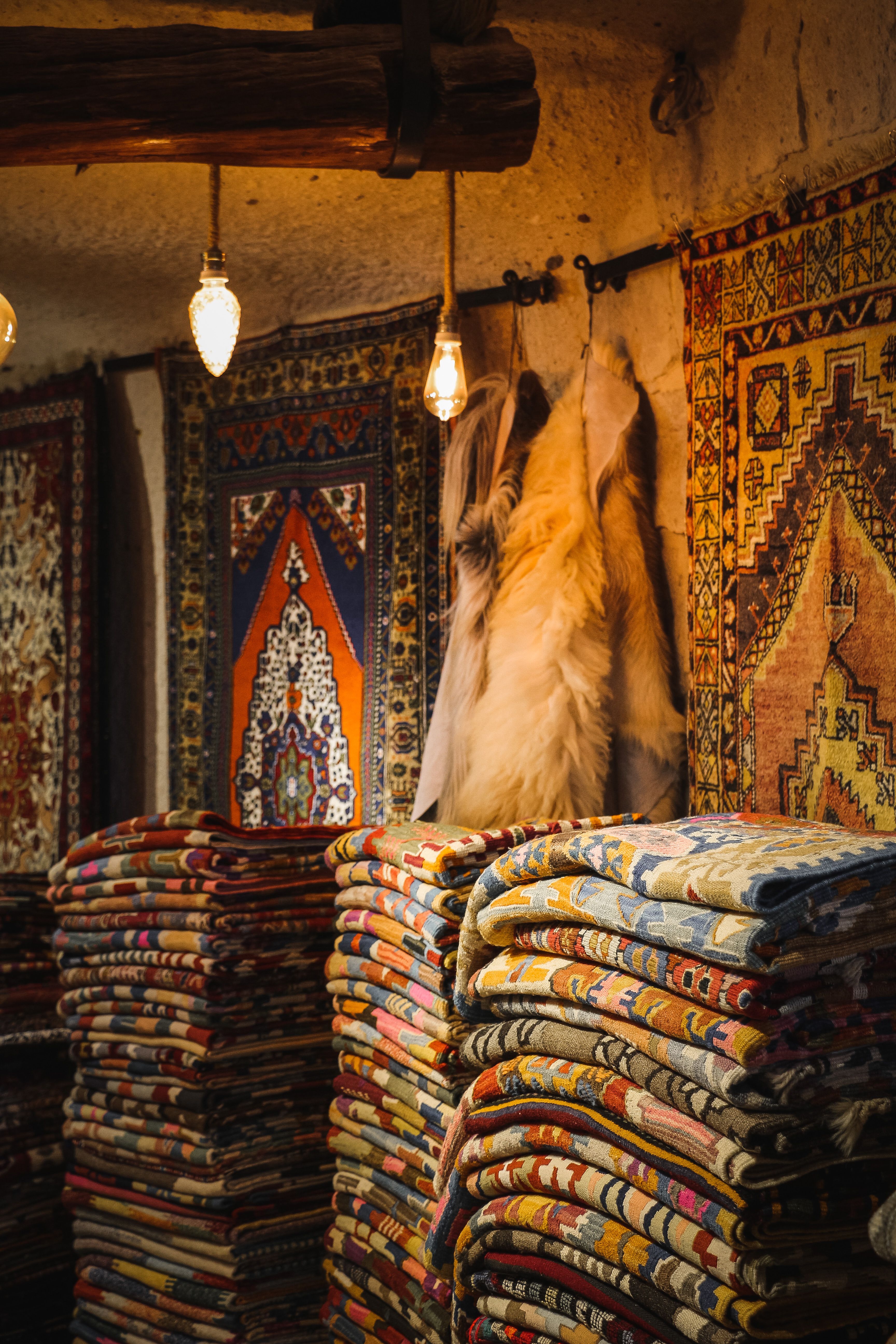 A rug shop with many different types of rugs · Free Stock Photo