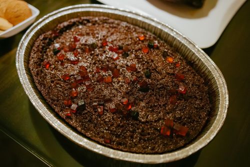 Free Indulge in this homemade chocolate cake adorned with vibrant candied toppings, perfect for desserts. Stock Photo