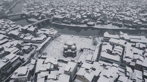 Snow blankets the historic buildings of Srinagar, showcasing its unique winter charm from above.