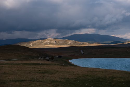 Clouds over Plains with Hills behind