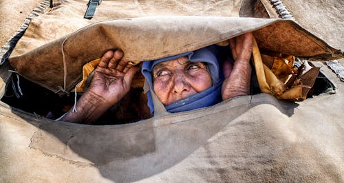 Woman Peeking through Fabric