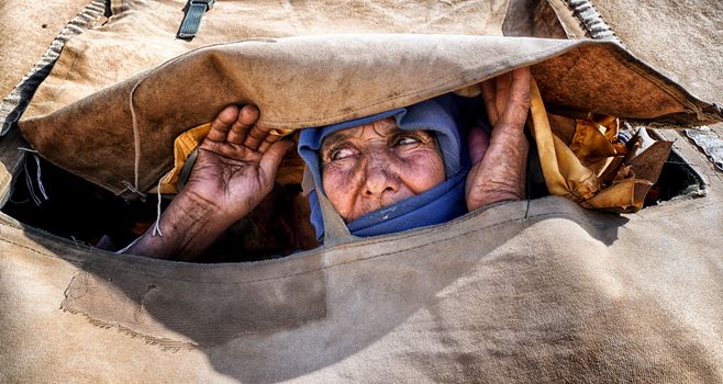 Woman Peeking through Fabric