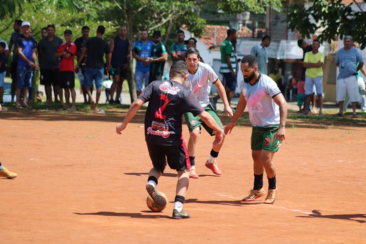 People Watching Men Playing Football