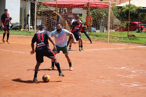 Photos gratuites de athlète, ballon de foot, ensemble