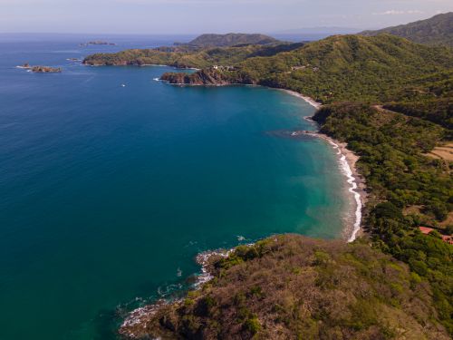 Free A breathtaking aerial view of the lush coastline and blue waters in Guanacaste, Costa Rica. Stock Photo