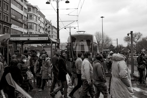 People Walking on Tram Stop in Istanbul in Black and White