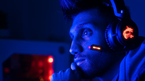Man Playing PC Game with Headphones
