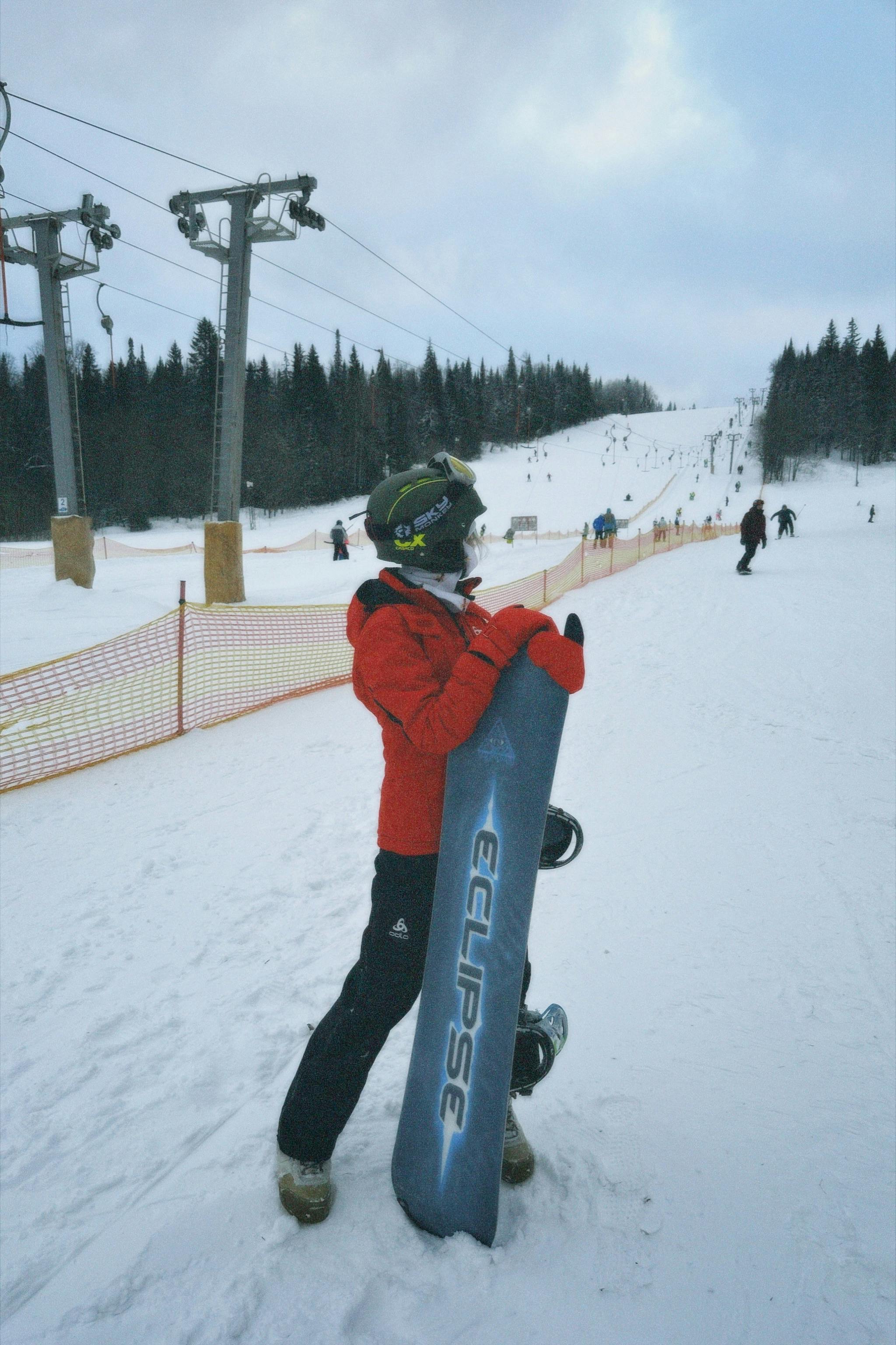 woman snowboarding on a slope