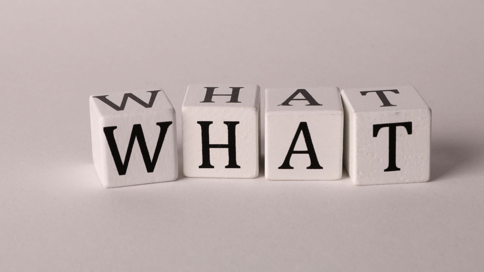 What is Modafinil? Unlocking the Mystery of This Smart Drug Close-up of wooden blocks with letters spelling 'What' on a white background, emphasizing curiosity and inquiry.
