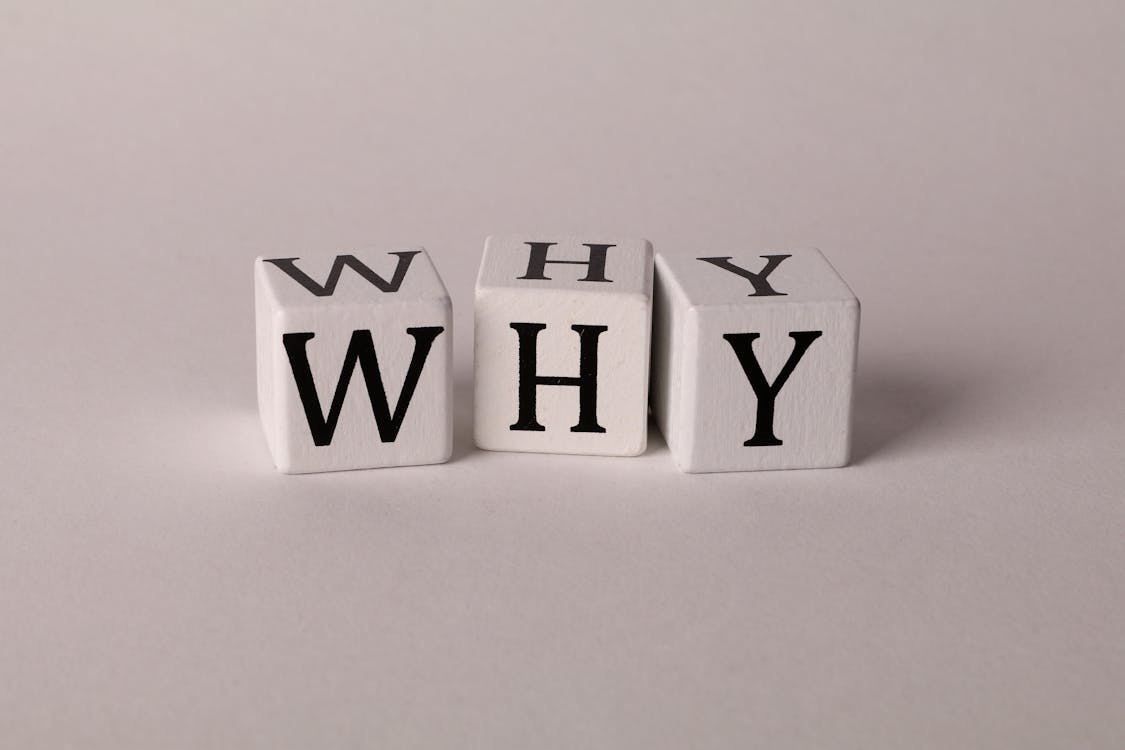 Free Close-up of lettered dice spelling 'WHY' on a neutral background, ideal for concepts of inquiry or curiosity. Stock Photo Free Close-up of lettered dice spelling 'WHY' on a neutral background, ideal for concepts of inquiry or curiosity. Stock Photo