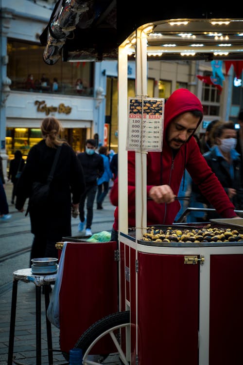 Man with a Food Cart on a City Street 