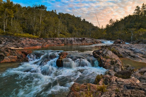 Waterfall Among Rocks in a Valley 