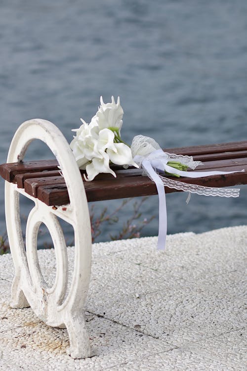 A Bridal Bouquet Left on a Bench 