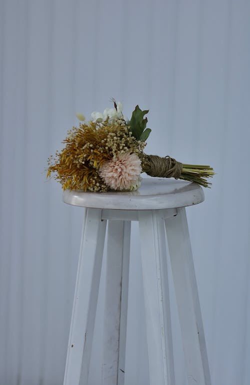A Bouquet on a White Chair 
