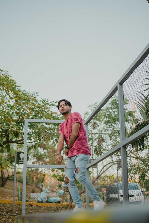 Young Man in Casual Clothing Outdoors in Summer