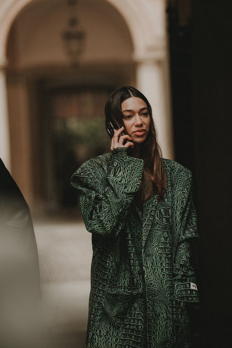 Woman Talking On Phone On City Street