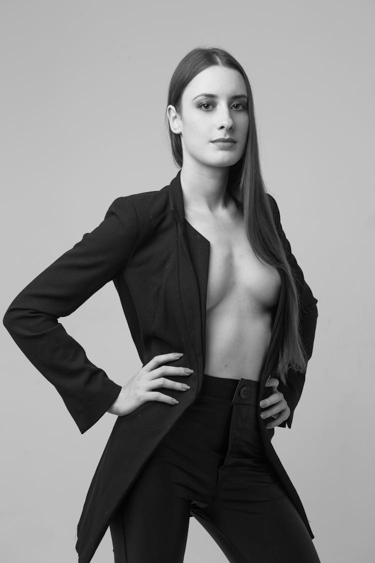 Woman Standing In Black Suit Without Shirt