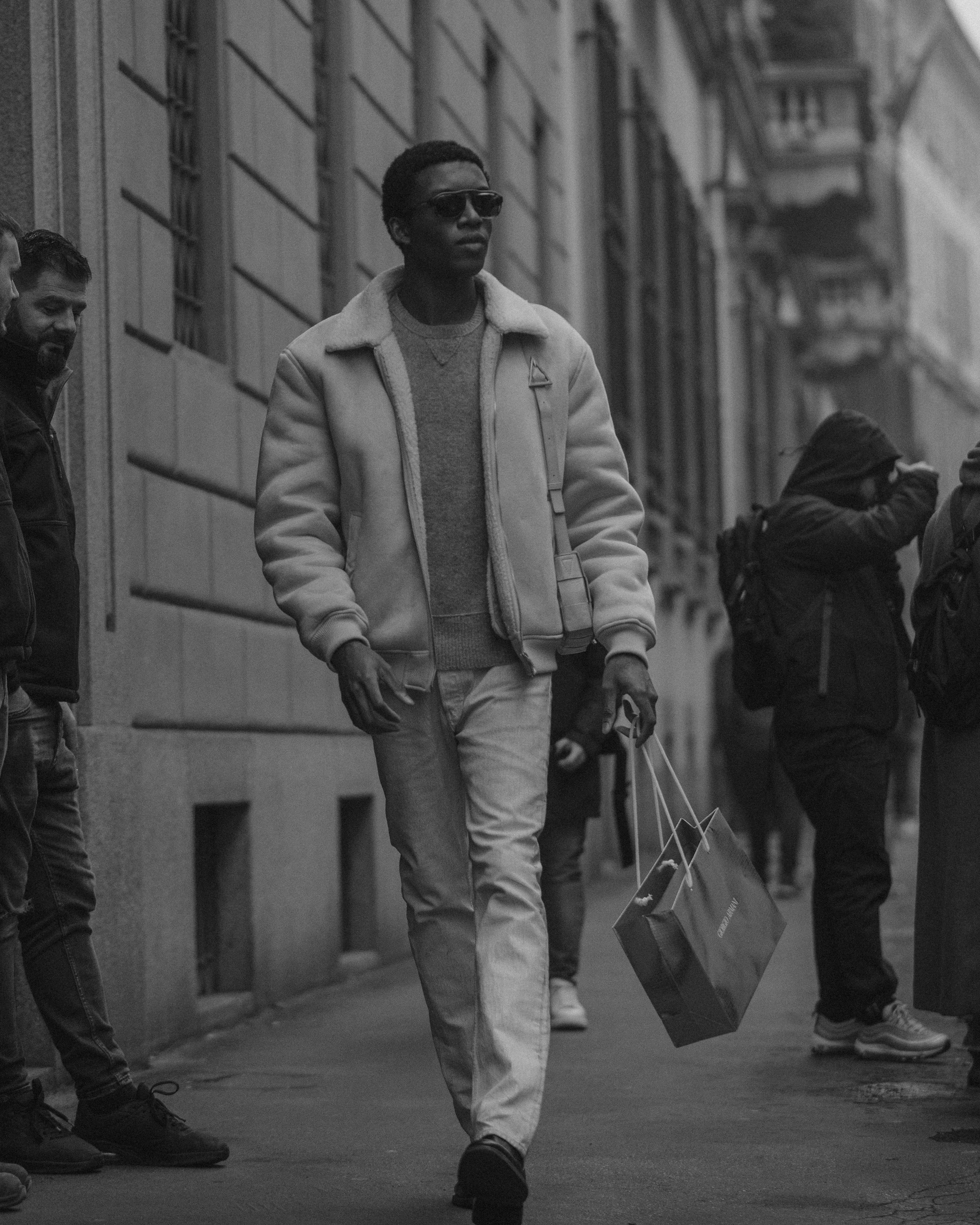 Man Carrying Bag in Black and White · Free Stock Photo