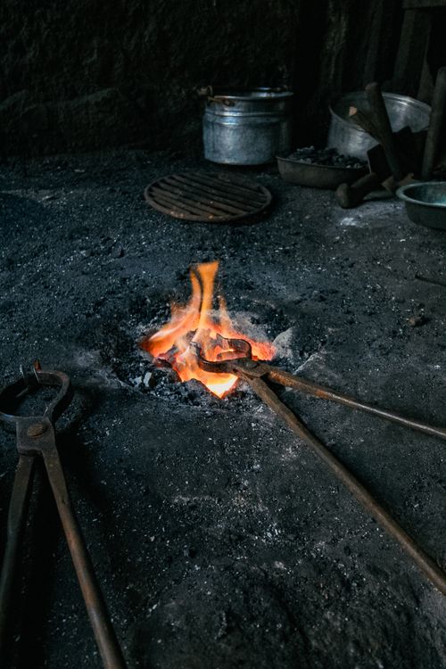 Free Close-up of a blacksmithing fire and tools in Denizli, Türkiye, capturing traditional craft. Stock Photo