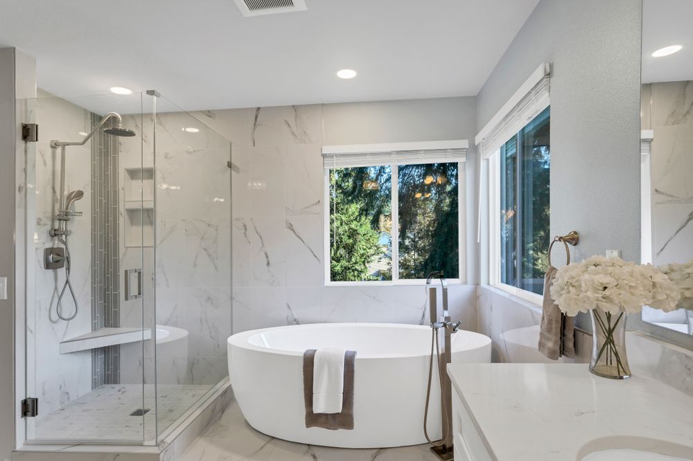 Elegant bathroom with freestanding bathtub and glass shower