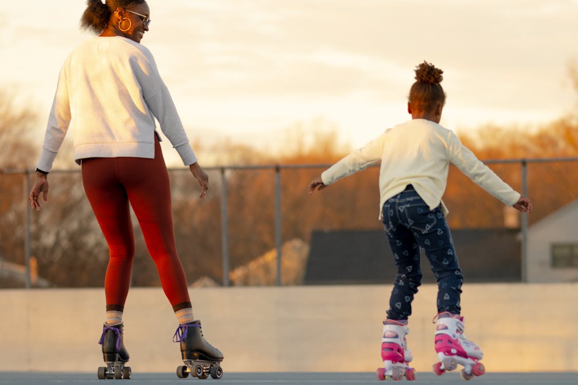 Mother and daughter roller skating