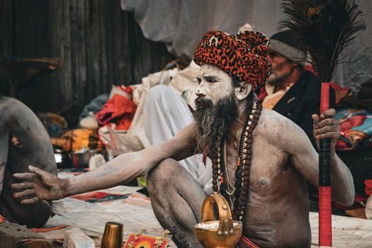 A man performing a traditional Hindu ritual outdoors, embodying cultural and religious heritage.