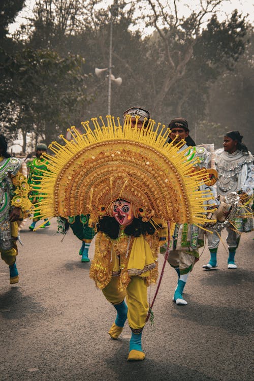 Dancer with Yellow Decoration at Parade on Street