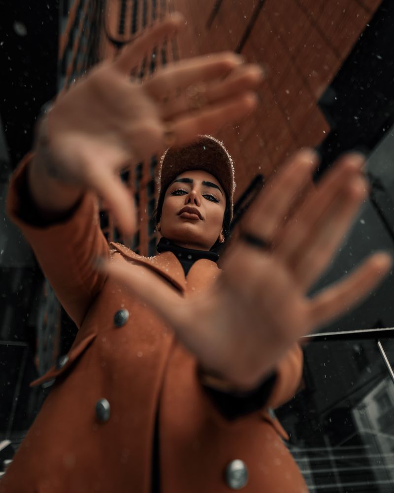 Woman in a winter coat and cap outdoors