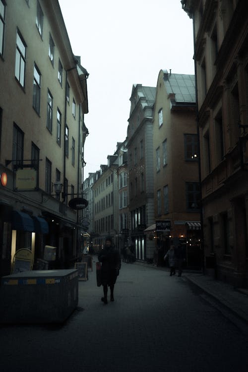 Pedestrians in Dark Alley