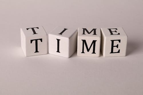 Time on Dices on White Background