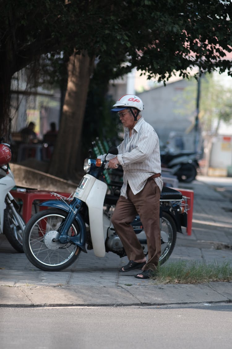 Elderly Biker On Street