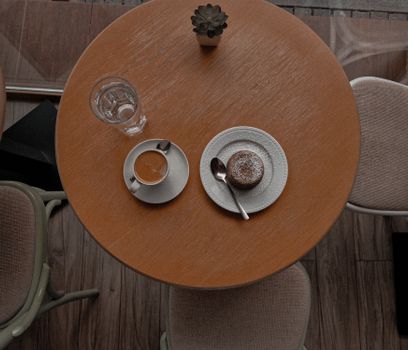 Cozy cafe setting with coffee and dessert on a wooden table, perfect for a warm and inviting atmosphere.