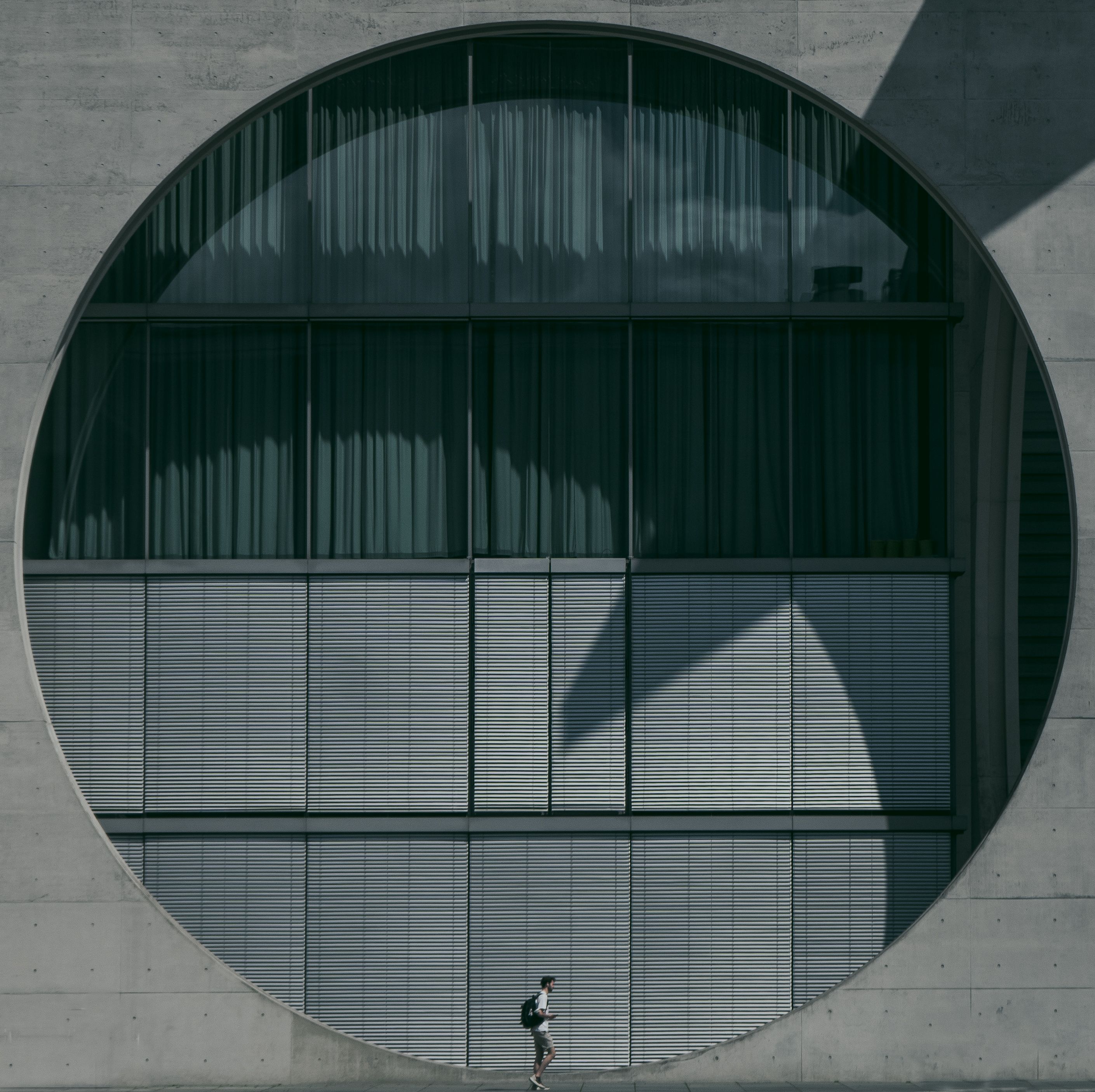Man Walking Past the Marie Elisabeth Luders House · Free Stock Photo