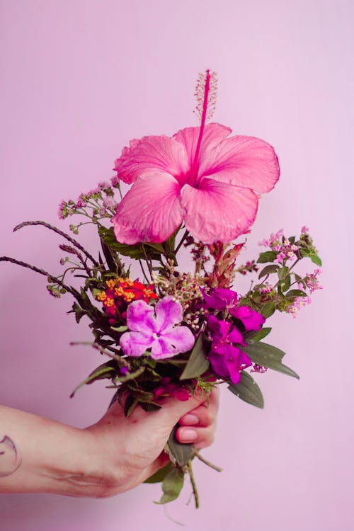 Close Up of Hand Holding Flower Bouquet