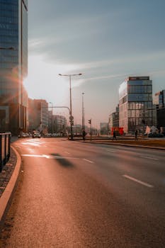 A sunlit urban scene featuring modern skyscrapers and city streets, capturing the essence of a bustling cityscape.