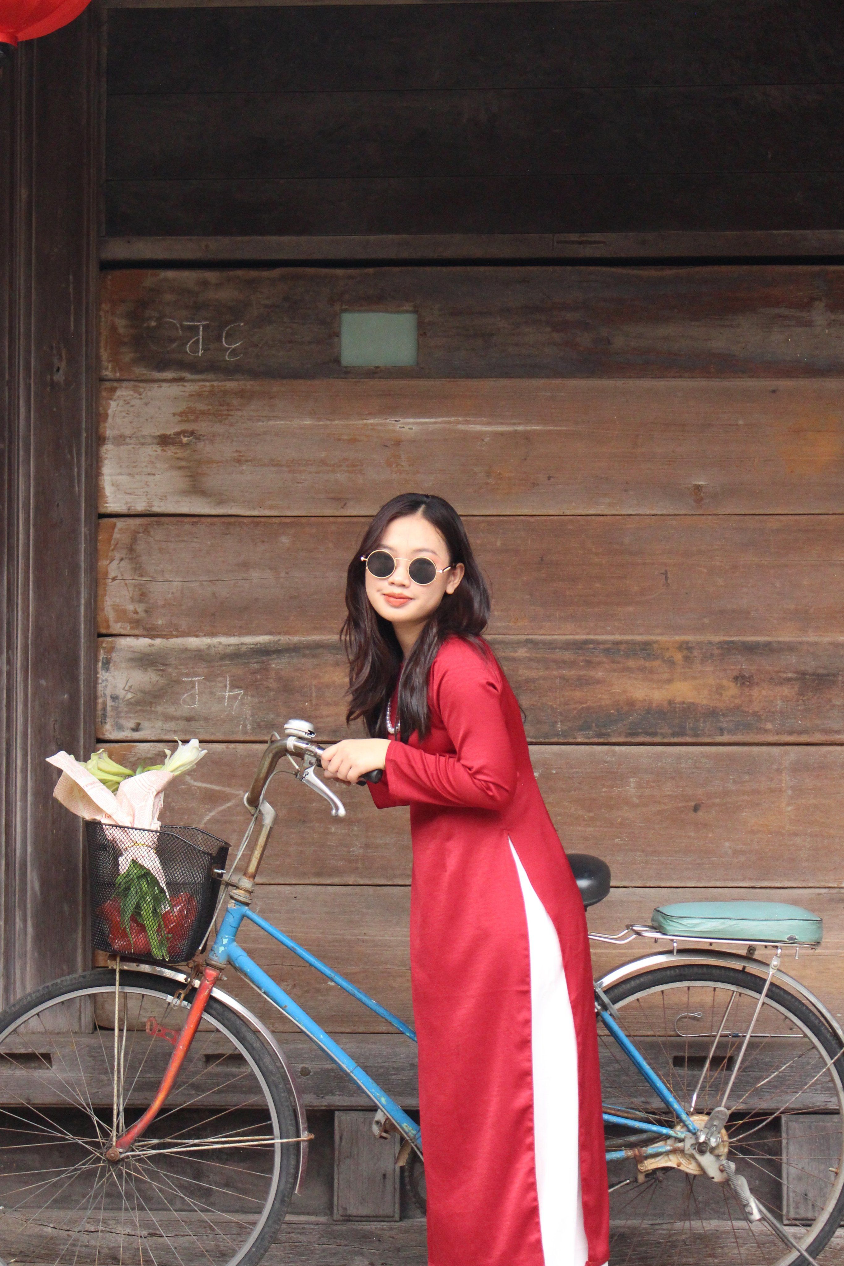 Woman in Red Dress Holding a Bicycle · Free Stock Photo