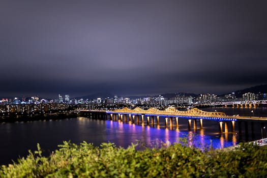 Stunning night view of Dongho Bridge over Han River, Seoul, with illuminated cityscape.