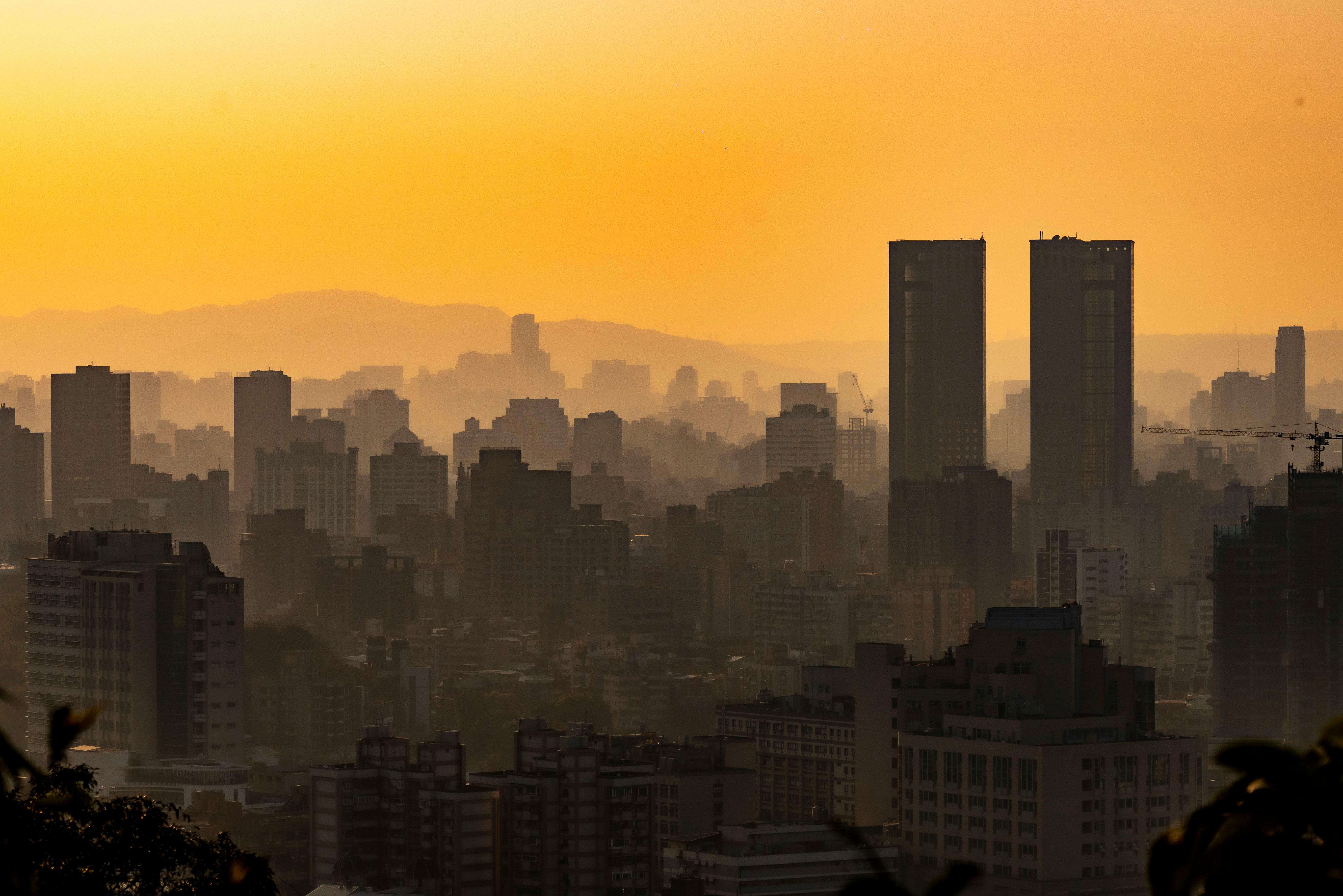 Yellow Sky over City at Sunset · Free Stock Photo