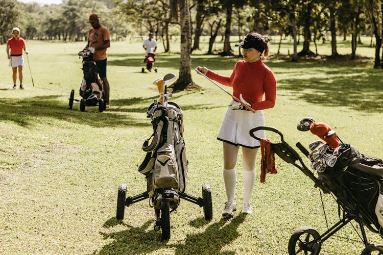 Woman In Skirt Playing Golf