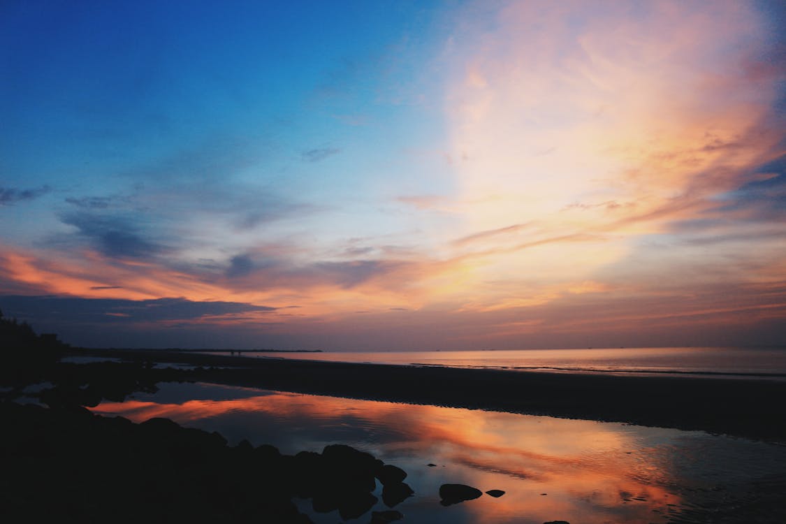 Calm Body of Water during Golden Hour