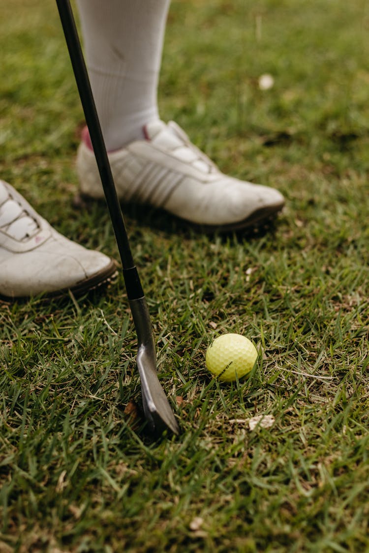 Close-Up Shot Of A Golf Ball On The Grass 