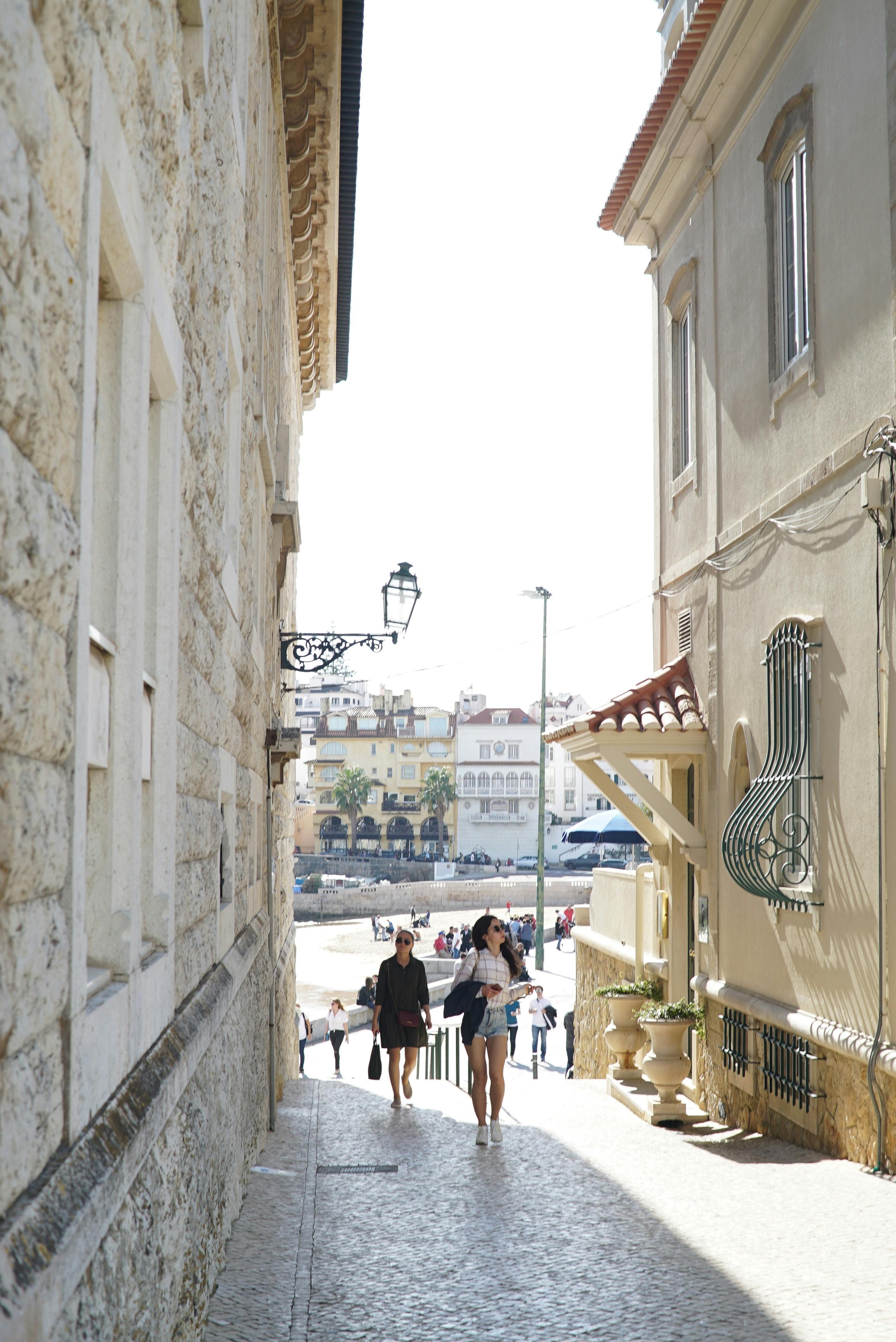 Tourists Walking in Alley
