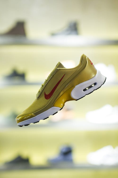 Stylish yellow running shoe in modern store