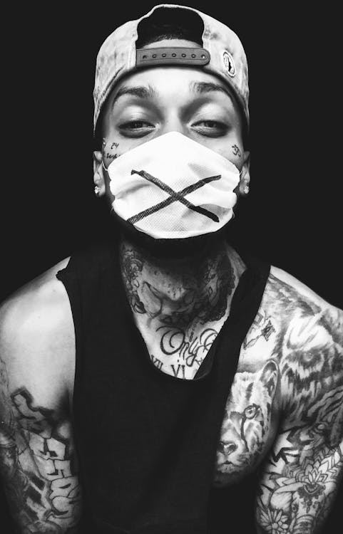 Tattooed Rapper with Face Mask · Free Stock Photo