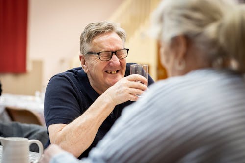 Woman Sitting with Laughing Man