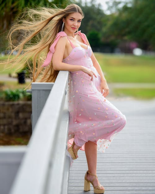 Blonde Woman Posing in Pink Dress