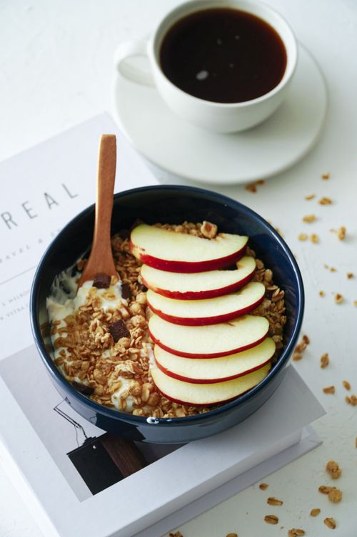 Free Delicious breakfast of apple muesli and black coffee served on a table in İstanbul. Stock Photo