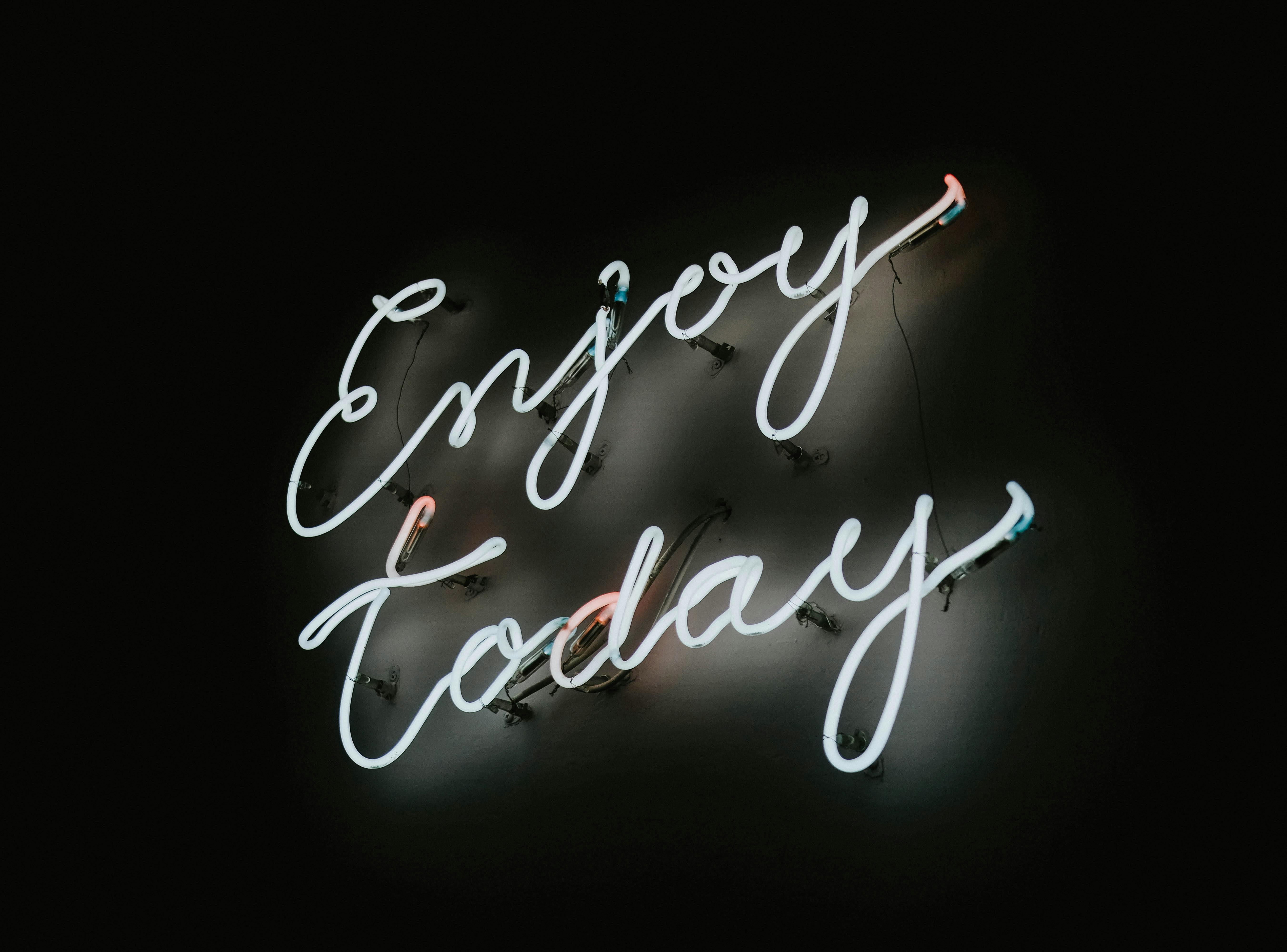 Neon Sign in a Black Background · Free Stock Photo