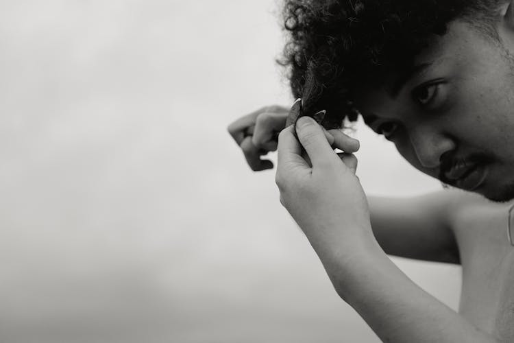 A Man Cutting His Hair 