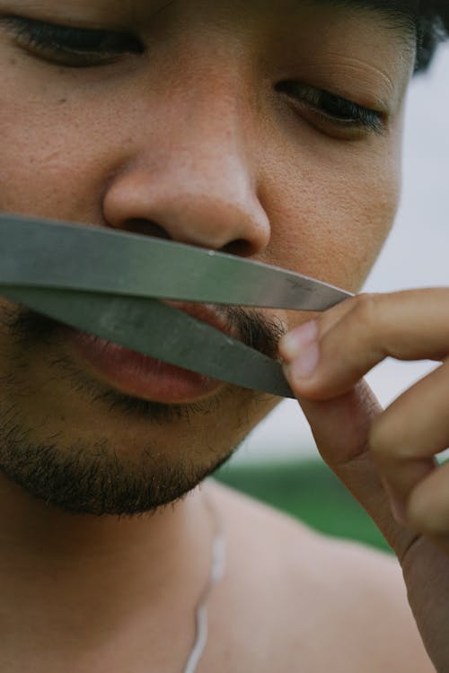 Man Cutting Moustache